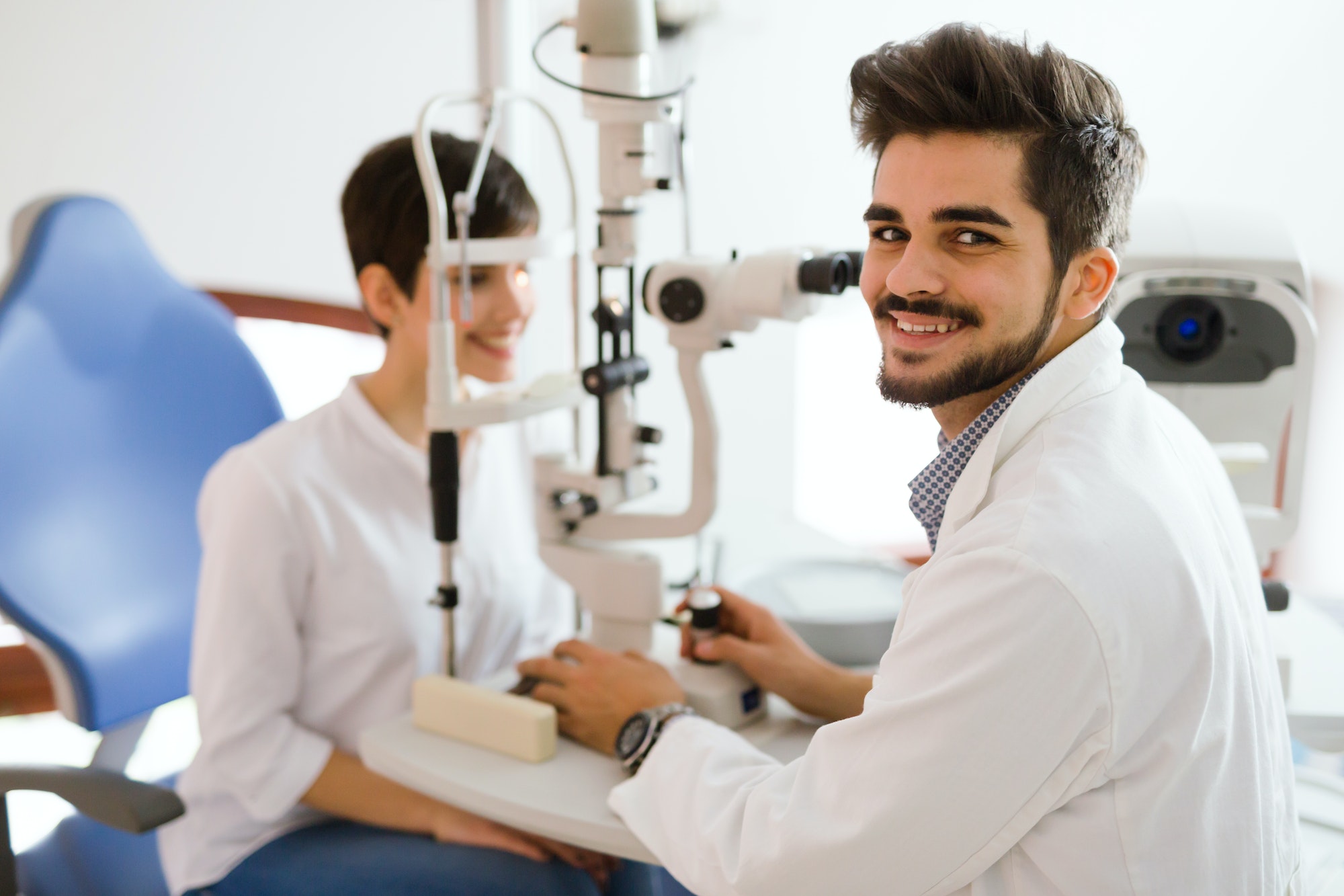 optometrist checking patient eyesight and vision correction